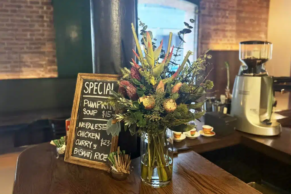 Artificial flower arrangement by Office Flower Solutions in use in a hospitality setting